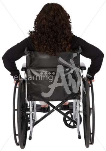 Jeanette listening in a wheelchair