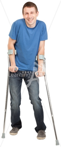 Tommy smiling with a crutches