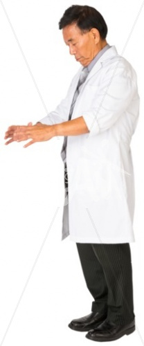John inspecting in a lab coat