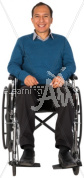 Christopher smiling in a wheelchair