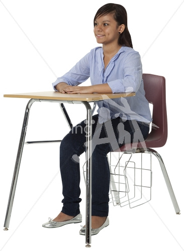 Olivia smiling in casual clothes at desk